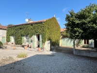 Attractive Stone Property with Gite, Swimming Pool And Outbuildings