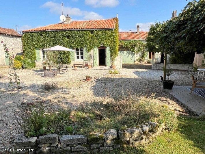 Attractive Stone Property with Gite, Swimming Pool And Outbuildings