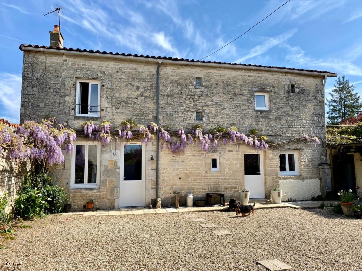 Beautiful Stone House with an enclosed mature garden, swimming pool and three bedrooms in an historic village close to Ruffec